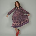 Woman wearing a 1970s Phool Cotton Gauze Dress  on a plain background