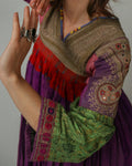 Person wearing a Vintage Embellished Afghan Kuchi Dress on a plain background